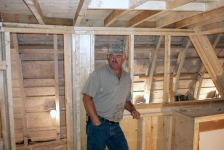 669: Bernard Mulrooney's new boat under construction in Placentia. This picture includes  the builder himself. (2004)